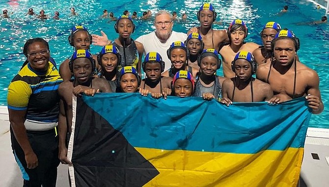 Team Bahamas celebrate with their CARIFTA under-14 gold and bronze medals in Miami, Florida.