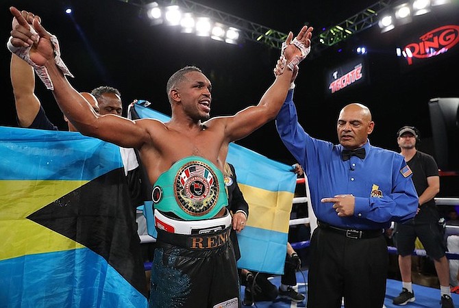 TUREANO Johnson has his arm raised by the ring referee in one of his victories.