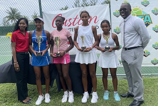 LEFT TO RIGHT: The duo of Tatyana Madu and Makeda Bain (left) defeated Curaçao’s Keziah Fluonia and Briana Houlgrave (right) in the girls’ doubles finals yesterday at the National Tennis Centre (NTC)