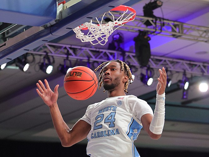 ABOVE THE RIM: Jae’Lyn Withers and the North Carolina Tar Heels routed the Northern Iowa Panthers 91-69 yesterday on day 1 of the Battle 4 Atlantis men’s tournament at the Atlantis resort’s Imperial Arena, Paradise Island, to arrange a Thanksgiving meeting in today’s semifinals. Photo: Dante Carrer
