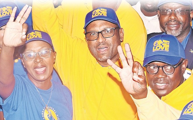 Kingsley Smith, centre, celebrating after his victory in the West Grand Bahama and Bimini by-election. 
Photo: Vandyke Hepburn