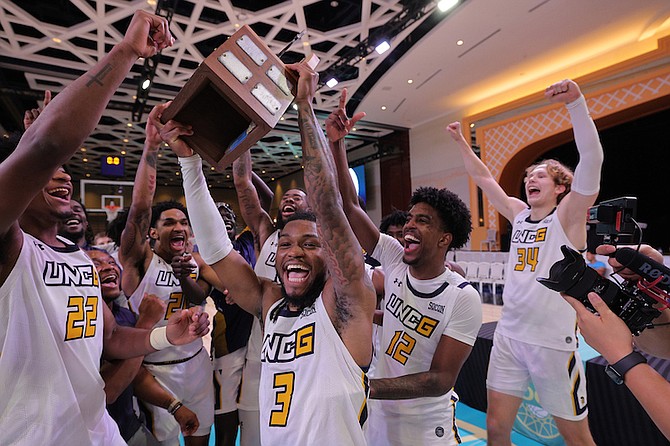 University of North Carolina at Greensboro Spartans celebrate after winning the Baha Mar Hoops Nassau Championships yesterday in the Convention Center at Baha Mar.
Photos: Dante Carrer