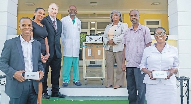 Princess Margaret Hospital Foundation chairman Prof Dr Magnus Ekedede and hospital administrator Mary Walker flank the $42,000 craniotome tool donated by the foundation. Also pictured are members of the foundation board and hospital senior staff.