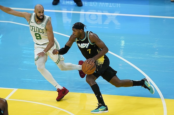 PACERS’ Buddy Hield (7) goes to the basket against Celtics’ Derrick White (9) during the second half of their NBA basketball In-Season Tournament game.
(AP Photo/Darron Cummings)