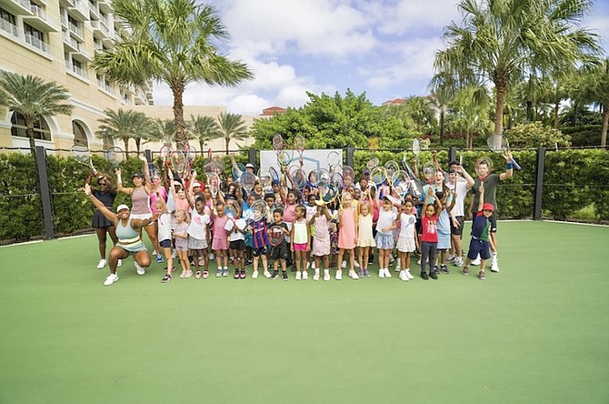 LENDING A HAND: The fourth Baha Mar Cup wrapped up yesterday with the hosting of a kids’ tennis clinic at the Baha Mar Racquet Club.