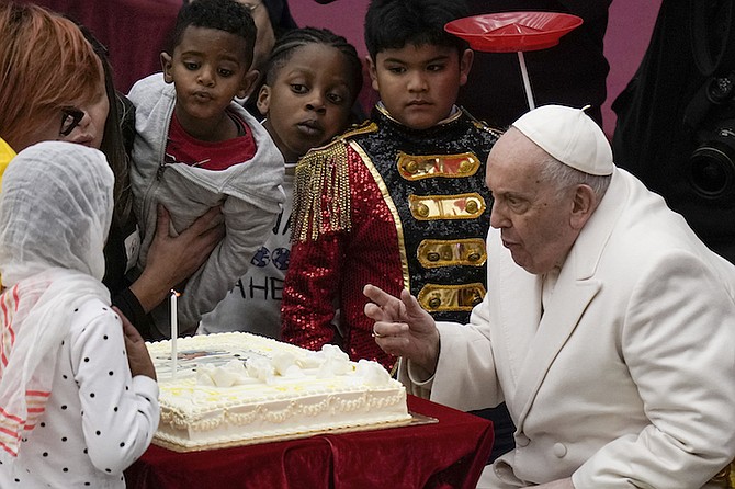 POPE Francis blows a candle on a cake as he celebrates his birthday with children assisted by the Santa Marta dispensary during an audience in the Paul VI Hall, at the Vatican, Sunday, Dec. 17, 2023. Pope Francis turned 87 on December 17.
Photo: Alessandra Tarantino/AP