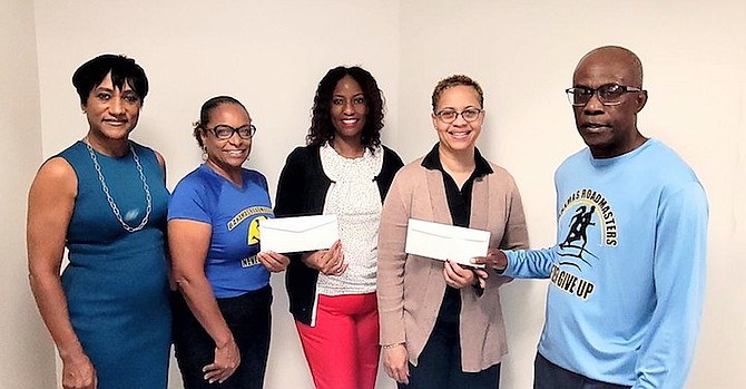 PICTURED, from left to right: Tina Lightbourne, City of Hope (formerly, Cancer Treatment Centers of America), Bahamas Half Title Sponsor; Anastacia Turnquest, BRRC President; Shantell Cox, Sister Sister Breast Cancer Support Group; Melissa Major, MD Patient Navigation Services; and Michael Cunningham, BRRC Vice President.