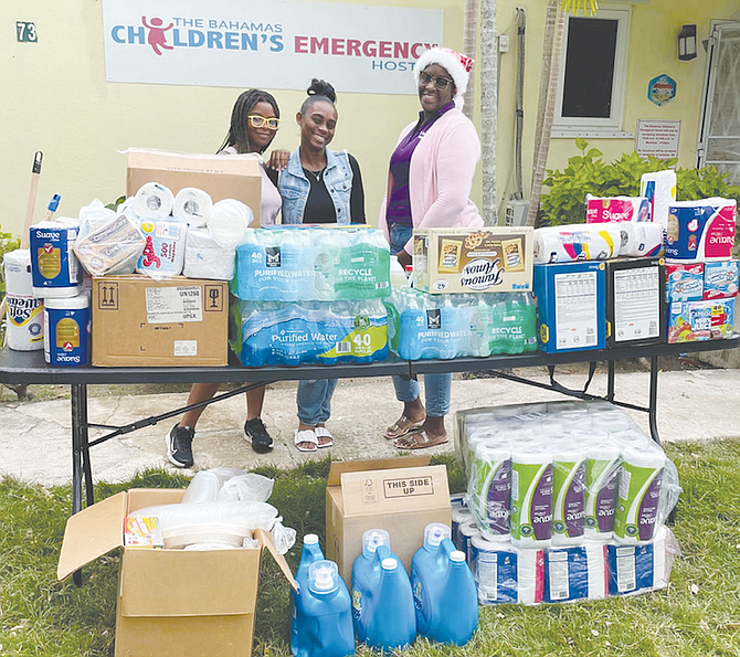 SISTERS Sarai and Sydney Clarke with Charlene Gibson, the business and operations manager at the Bahamas Children’s Emergency Hostel. 
Photo: Tenajh Sweeting/Tribune Staff