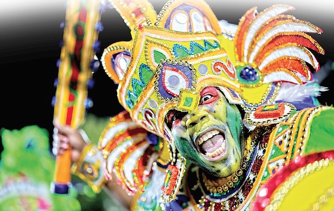 A member of Shell Saxon Superstars rushing during the Boxing Day Junkanoo Parade. The Saxons placed first in the A category.
Photo: Dante Carrer