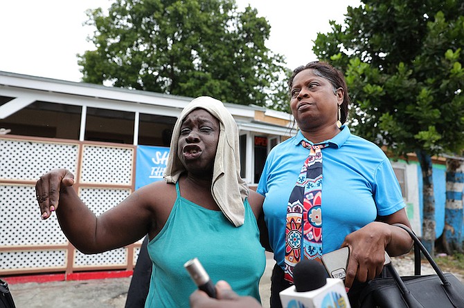 The mother of Dino Bain cries in despair after police shot and killed her 27-year-old son yesterday on Dean Street, just hours away from his birthday.
Photo: Dante Carrer
