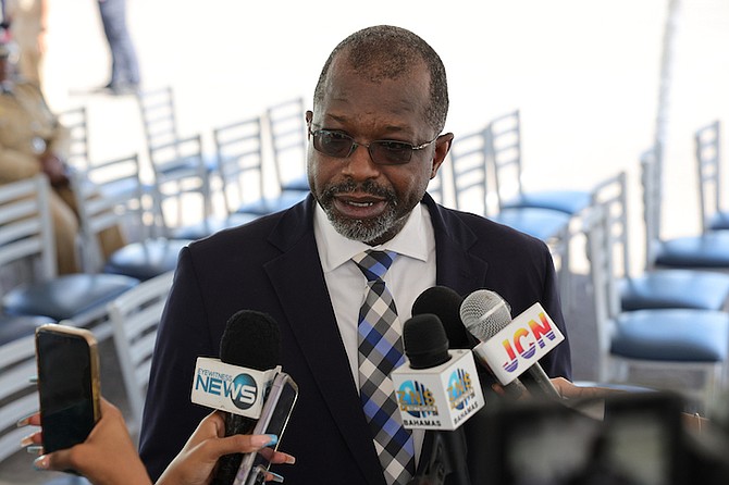 Minister of National Security Wayne Munroe KC speaks to reporters during a ceremony where Safeboat vessels and other lifesaving equipment was donated to the Royal Bahamas Police Force (RBPF) by The US Embassy at the Police Training College on Friday. Photo: Dante Carrer