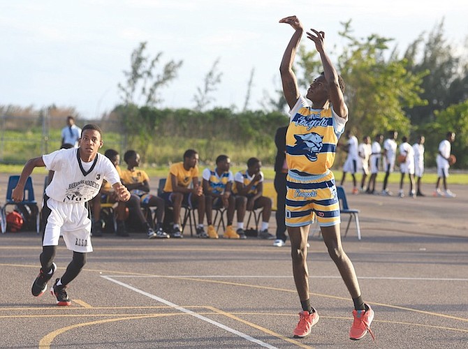ON THE REPLAY: The Charles W Saunders Cougars senior boys beat the Bahamas Academy Stars 75-23 in Bahamas Association of Independent Secondary Schools senior boys’ basketball action yesterday. 
Photo: Moise Amisial