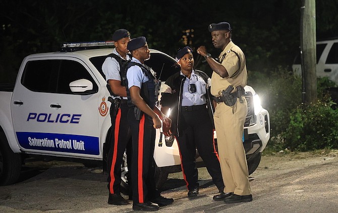 POLICE on the scene at Ragged Island Street where three people were shot.
Photo: Moise Amisial