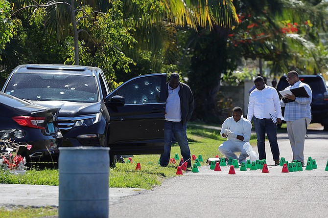 Police at the scene of the shooting on Saturday. Photos: Dante Carrer