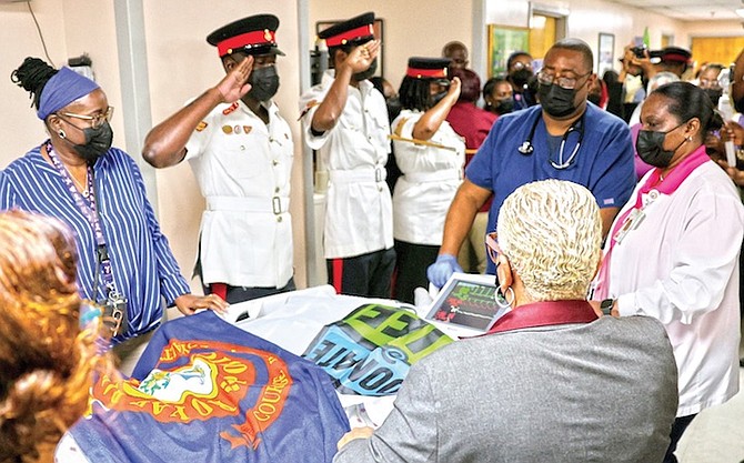 YESTERDAY police officers, family, friends and medical personnel line along a corridor in Doctors Hospital for the final farewell of Inspector Tomas McIntosh who was left brain-dead by a traffic accident last week.
Photos: Dante Carrer