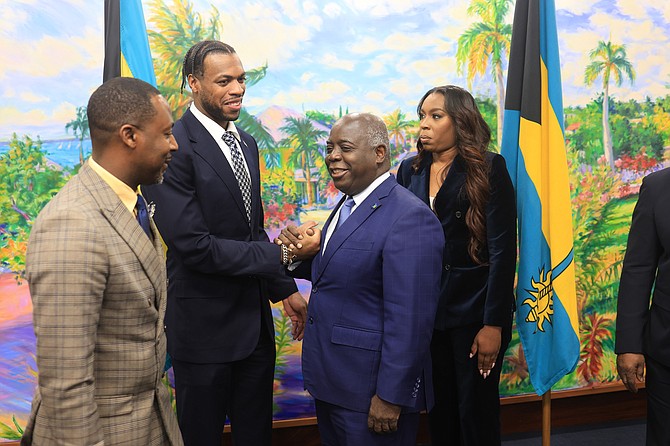 CHAVANO “Buddy” Hield, second from left, has been appointed as the ambassador-at-large by Prime Minister Phillip “Brave” Davis, second from right, at the Office of the Prime Minister.