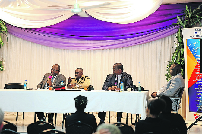 NATIONAL Security Minister Wayne Munroe, a representative from the RBPF, Bahamas Bar President Khalil Parker and Bahamas Christian Council president Delton Fernander were panellists at the Rotary Club’s forum on crime and solutions to crime. 
Photo: Moise Amisial