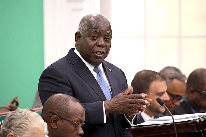Prime Minister Philip “Brave” Davis delivers the mid-year budget communication during a sitting of the House of Assembly yesterday. 
Photo: Dante Carrer