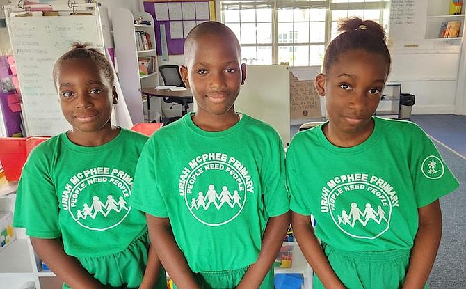 Triplets Sammia, Serrenda and Brenden, fifth graders who attend Uriah McPhee Primary School.