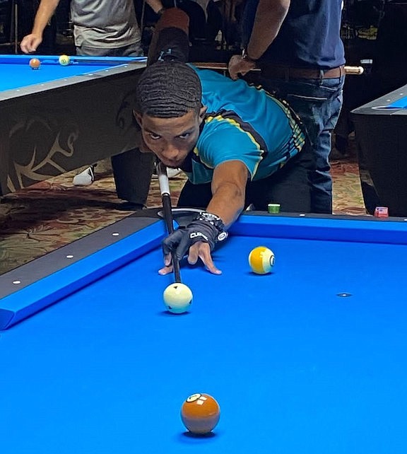 DAKARAI Turnquest in action on the pool table.
