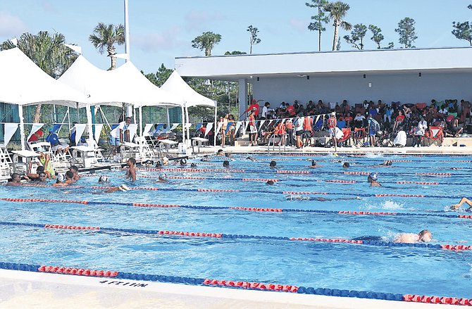 SWIMMERS in action during the CARIFTA Swimming Trials at King’s College School.