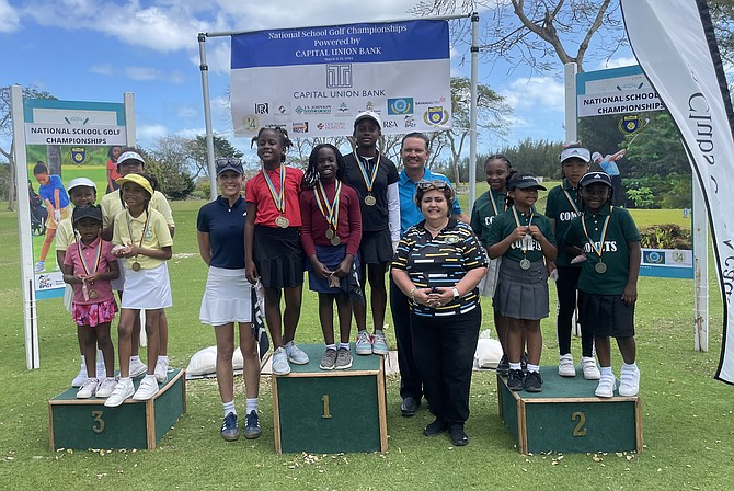 FEELING VICTORIOUS: The Poitier Golf home school prevailed in the lower primary girls division with a total of 118. Placing second was Queen’s College with 161 and Summit Academy came third with 165.