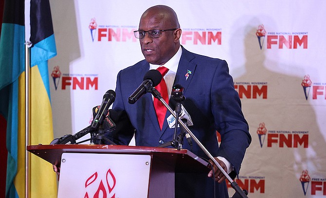 FREE National Movement (FNM) leader Michael Pintard speaks during a press conference to announce
the party’s Anti-Crime Community Initiative at FNM Headquarters yesterday.
Photo: Dante Carrer