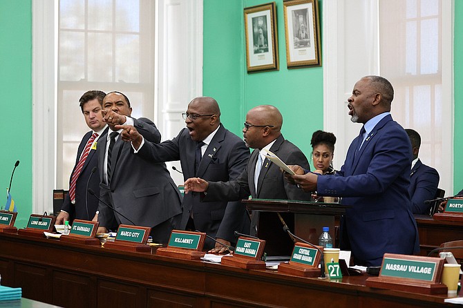 Opposition leader Michael Pintard (centre) and FNM members of Parliament Adrian White, Shanendon Cartwright, Kwasi Thompson and Iram Lewis, row over the shortened session during yesterday’s sitting of the House of Assembly. 
Photo: Dante Carrer