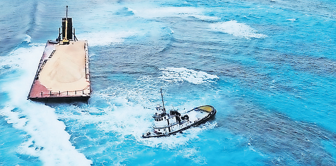 BARGE and tug boat encountered rough seas while on their way to deliver pea rock to Baker’s Bay ending up stranded on the reef in the Man-O-War Cay channel.