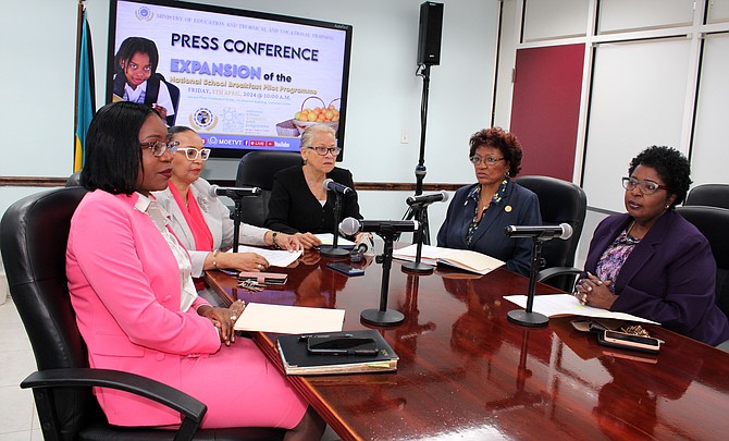 Minister of Education Glenys Hanna-Martin (center) announces the expansion of the National School Breakfast Pilot Programme to five schools in New Providence.