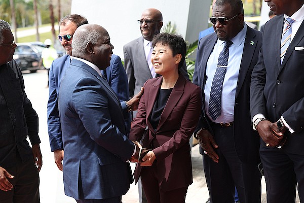 Outgoing Chinese Ambassador to The Bahamas Dai Qingli greets Prime Minister Philip "Brave" Davis during an event to mark the formalization of the renovation and maintenance project of The National Stadium on April 8, 2024. Dante Carrer