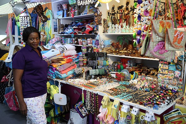 Janet Miller of J&J Souvenirs poses by her stall in the newly renovated Paradise Island Straw Market after a ceremony to mark the re-opening of the market on April 11, 2024. Photo: Dante Carrer
