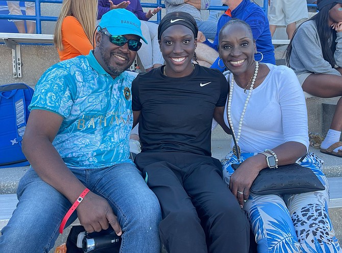 Charisma Taylor is flanked by her parents Dewey and Patrice Taylor in Gainesville, Florida over the weekend.