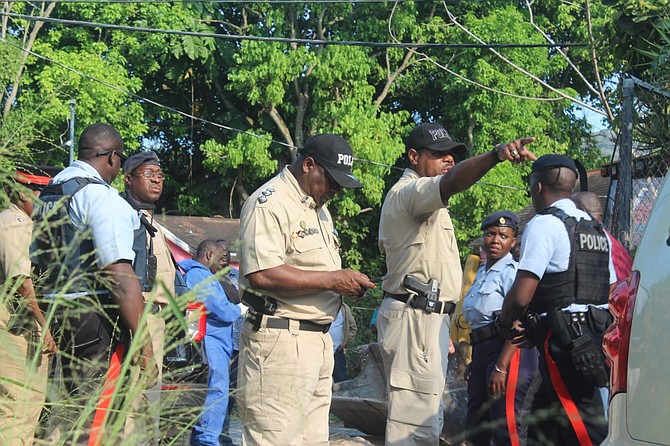 Police at the scene of the Kemp Road murder on Friday. Photo: Shaquille Johnson