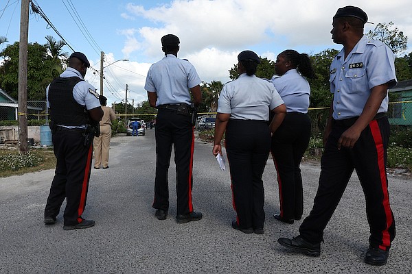 Police officers at the scene on Nelson Street in Yellow Elder where a man was killed by an assailant who shot him multiple times with a high power weapon on April 15, 2024. Dante Carrer