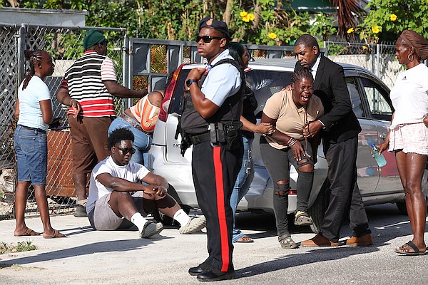 Relatives of man shot to death in the Yellow Elder area mourning yesterday. Photo: Dante Carrer