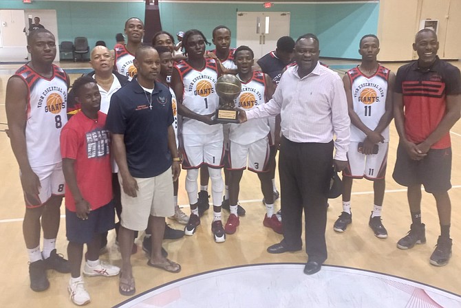 Your Essential Store Giants receive their championship trophy from NPBA president Ricardo Smith.