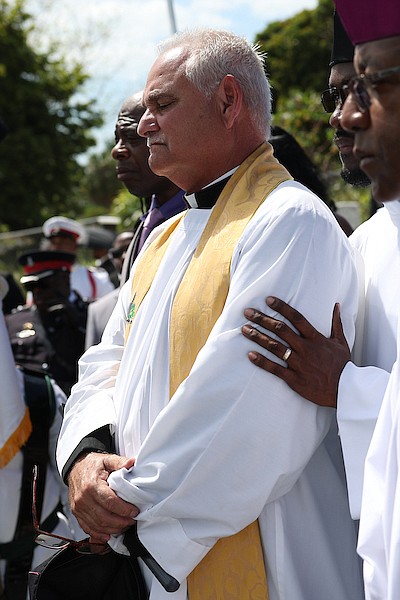 Archdeacon Keith Cartwright during the interment of former MP Donald “Don” Saunders at St Agnes Cemetery. Photo: Dante Carrer