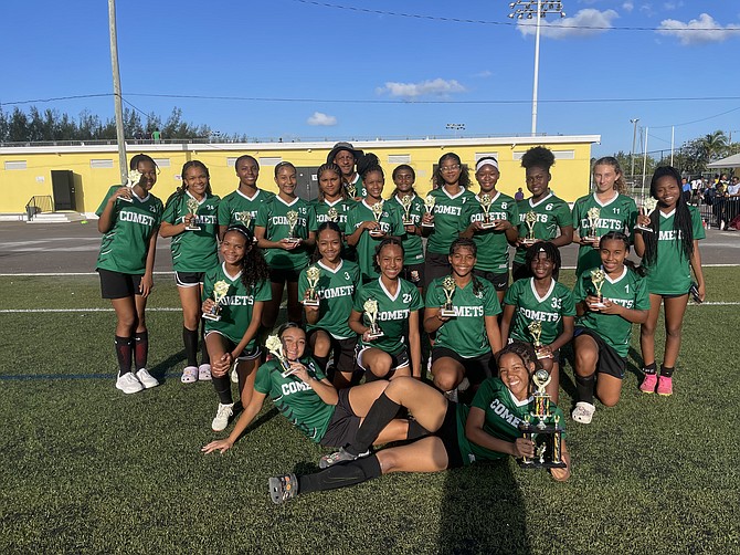 BRAGGING RIGHTS: The Queen’s College Comets junior girls wrapped up an undefeated season with 4-1 championship win over St Andrew’s International School Hurricanes in the BAISS Soccer Championships. Photos: Tenajh Sweeting/Tribune Staff