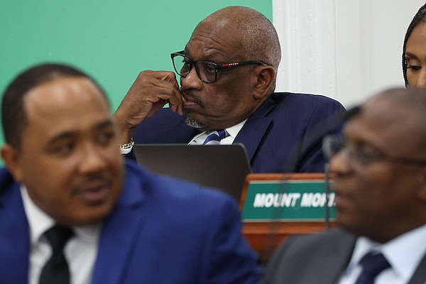 Killarney MP and former Prime Minister Hubert Minnis, Free National Movement deputy leader Shanendon Cartwright and Opposition Leader Michael Pintard during a sitting of the House of Assembly on April 17. Photos: Dante Carrer
