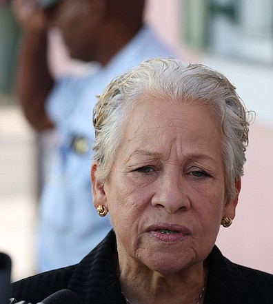 Minister of Education and Technical and Vocational Training Glenys Hanna-Martin speaks to reporters outside the House of Assembly on May 1, 2024. Photo: Dante Carrer