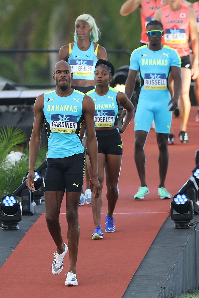 The mixed relay team coming out on the track as they prepared to qualify for the Olympics. 
Photo: Dante Carrer