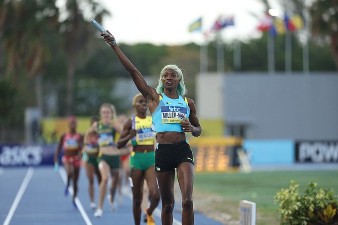 Shaunae Miller-Uibo raises the baton in victory as she comes home in first in the 4x400m mixed relays - ensuring The Bahamas booked its place at the Paris Olympics. 
Photo: Dante Carrer