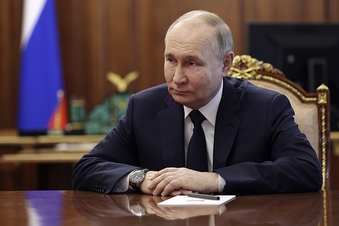 Russian President Vladimir Putin, right, listens to Mikhail Mishustin, the candidate for the post of Russian Prime Minister during their meeting at the Kremlin in Moscow, Russia, Friday, May 10, 2024. (Gavriil Grigorov, Sputnik, Kremlin Pool Photo via AP)