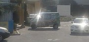A police car near liquor store premises in a video circulating on social media