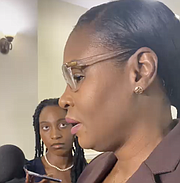 Minister of Labour Pia Glover-Rolle speaking to reporters after the death of Obie Wilchcombe
