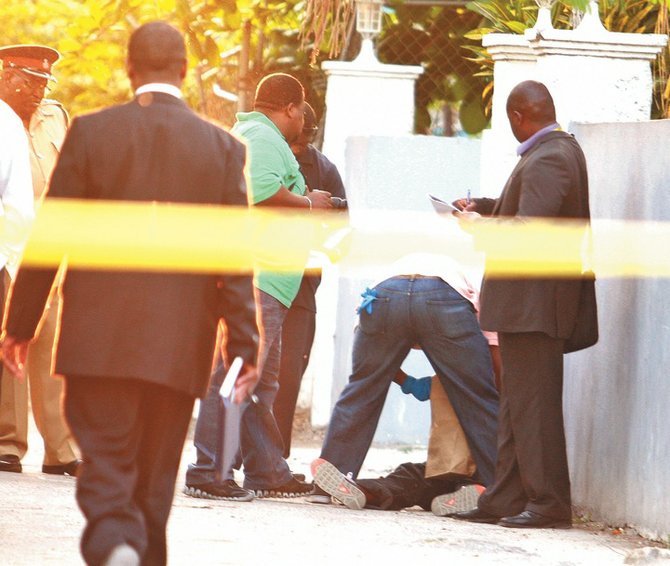 The murder scene where Noel 'Noey' Roker was shot outside his cousin's home in Dorsett Alley on Monday.