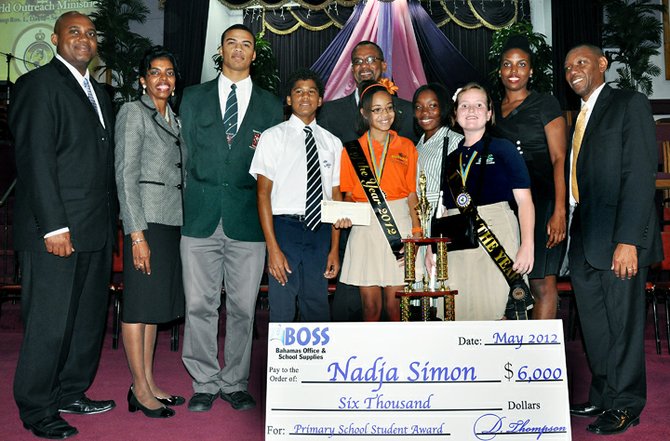 Minister of Education Jerome Fitzgerald with winners on Saturday and, left, with winner Nadja Simon, former winner Anna Albury and Genesis Academy principal Melody Treco-Hanna.