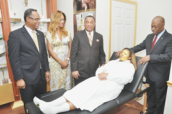 Prime Minister Perry Christie with Kaylisa Beneby at the launch of Flawless Skin and Body, pictured with a client as well as Tourism Minister Obie Wilchcombe, right, and Minister for Grand Bahama Dr Michael Darville, left. 

Photo: Vandyke Hepburn/BIS