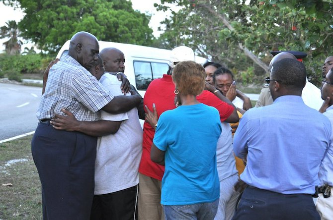 Shocked residents at the scene of the shooting. Photo/Vandyke Hepburn